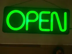 Green open neon sign